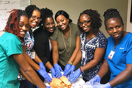 registered nurses receive hands-on training with a pig's lung