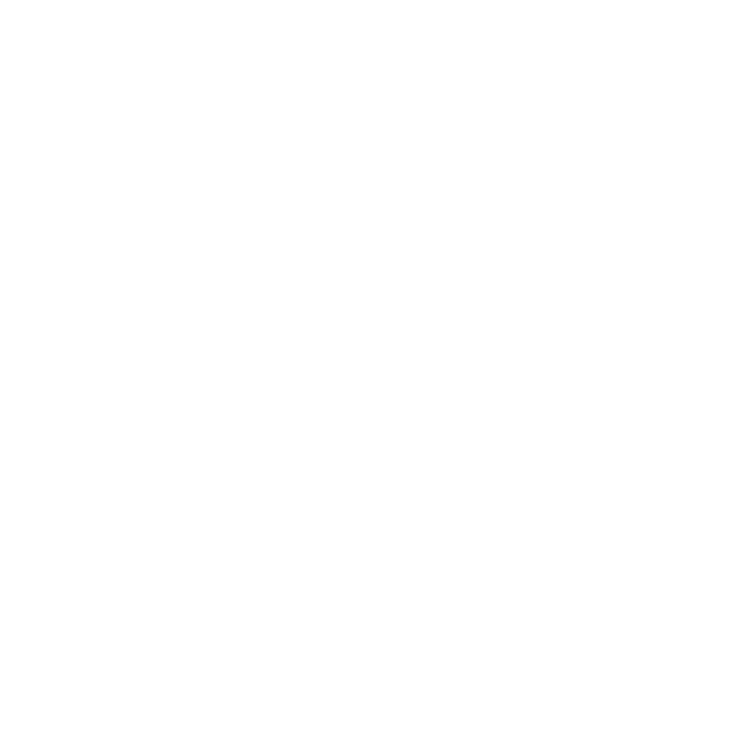 A person sits at a desk with a laptop, engaged in a consultation or meeting with another individual in a bright, modern