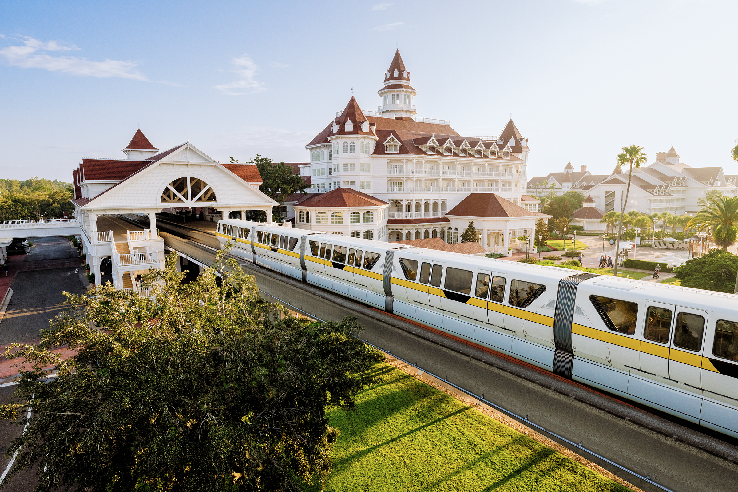 A monorail train passes over a track in front of the Grand Floridian Resort at Walt Disney World.
