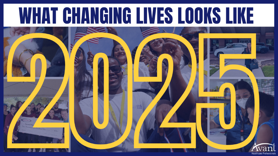 A diverse group of people celebrating outdoors with smiles, flags, and a large check, representing positive change in 2025.