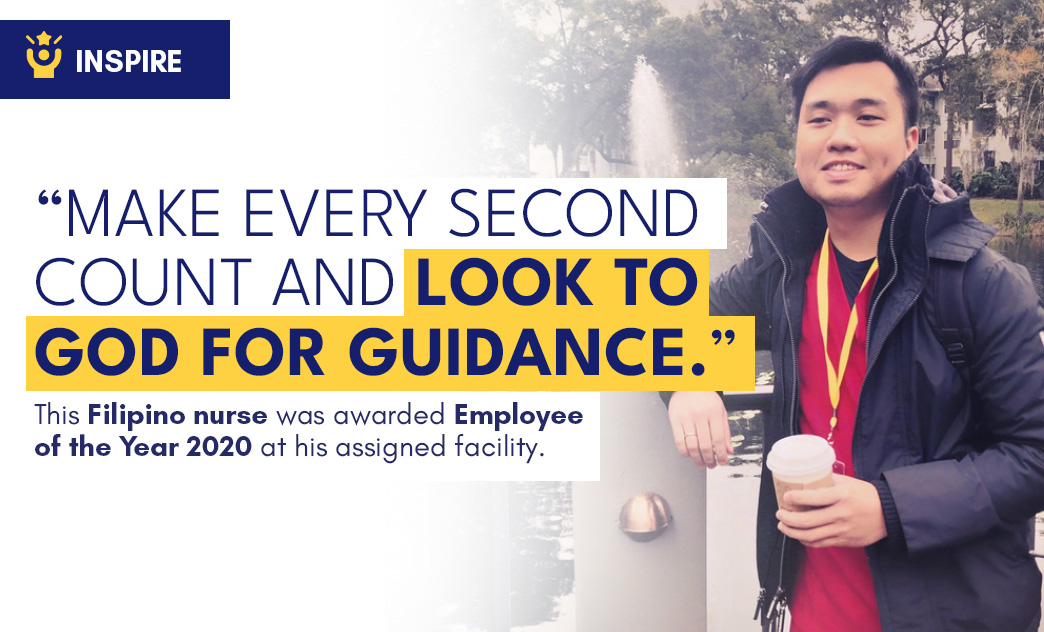 A Filipino nurse wearing a medal and holding a coffee cup, standing outdoors near a fountain with trees in the background.