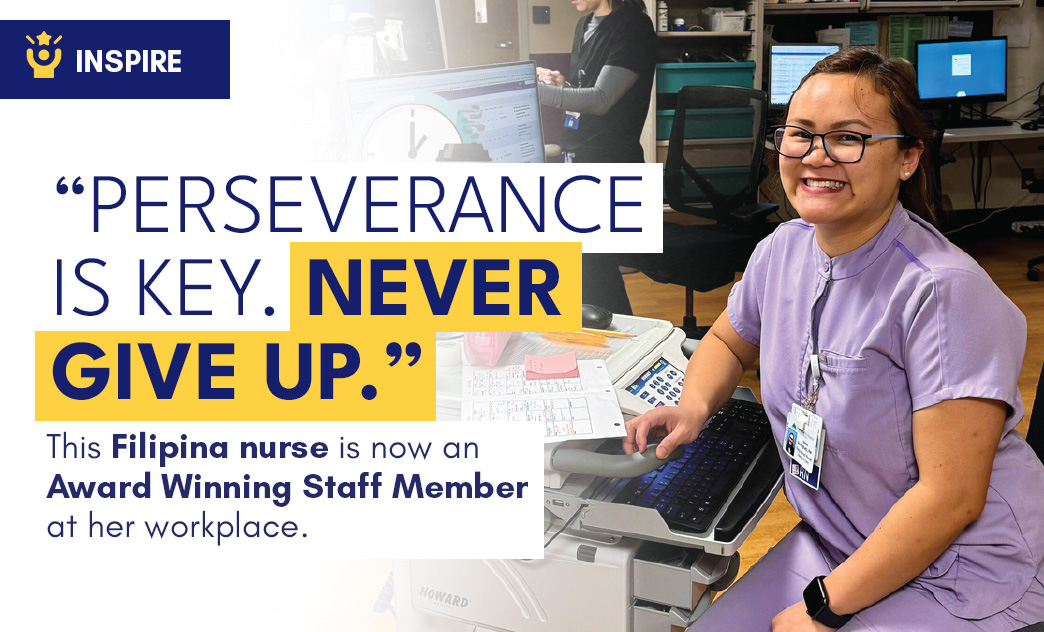 A smiling Filipino nurse in purple scrubs sits at a workstation with medical equipment and a computer in a hospital setting.