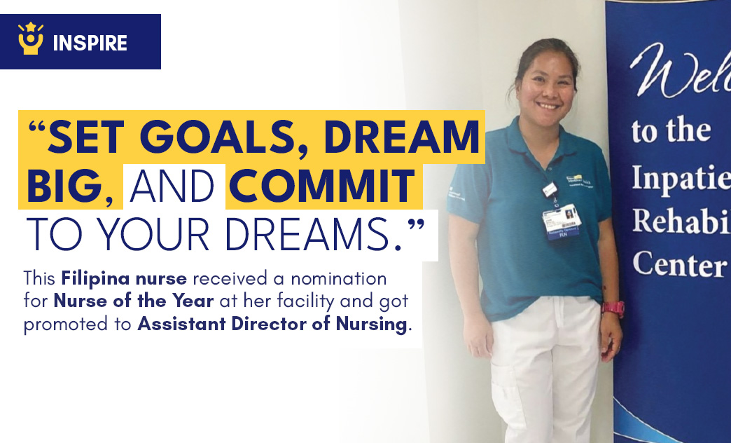 A smiling Filipino nurse in a blue uniform stands beside a banner at a rehabilitation center, celebrating her promotion to